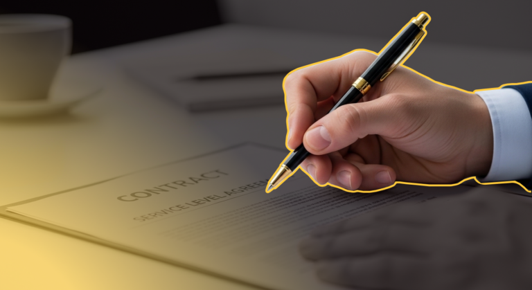 IT Support Service Level Agreements Featured Image - A Hand is reaching out to sign a contract