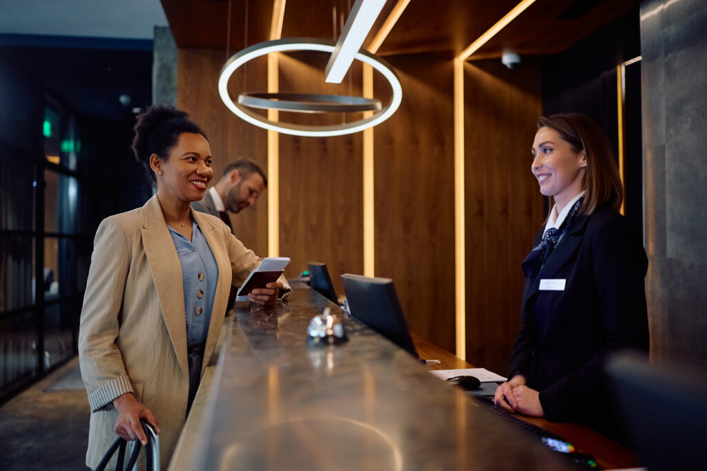guests checking into hotel with modern hotel phone systems