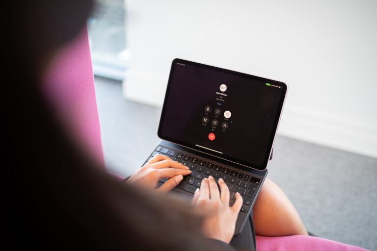 Laptop screen displaying unified communications for business platform with calls and messaging