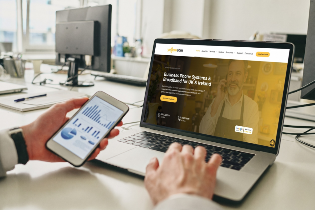 person using laptop on yellowcom website using cloud phone system for small business