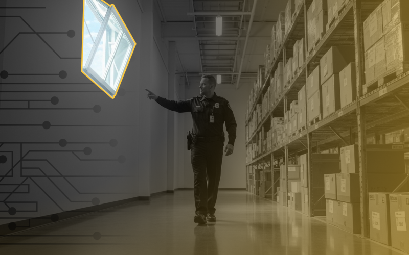 A security guard walks around a warehouse pointing at an open window. Metaphor of cybersecurity for small businesses