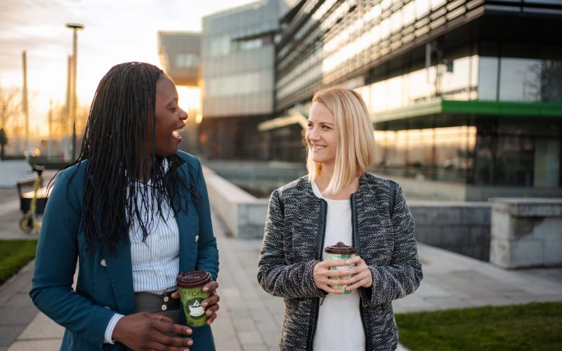 Business team leaving office building supported by telecoms provider UK communication systems